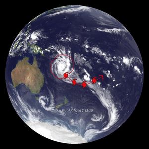 A hurricane is visible in the Pacific Ocean, east of Australia. A red line encircles the hurricane, and an arrow extends to the southeast, curving up to the northeast, illustrating the hurricane's path