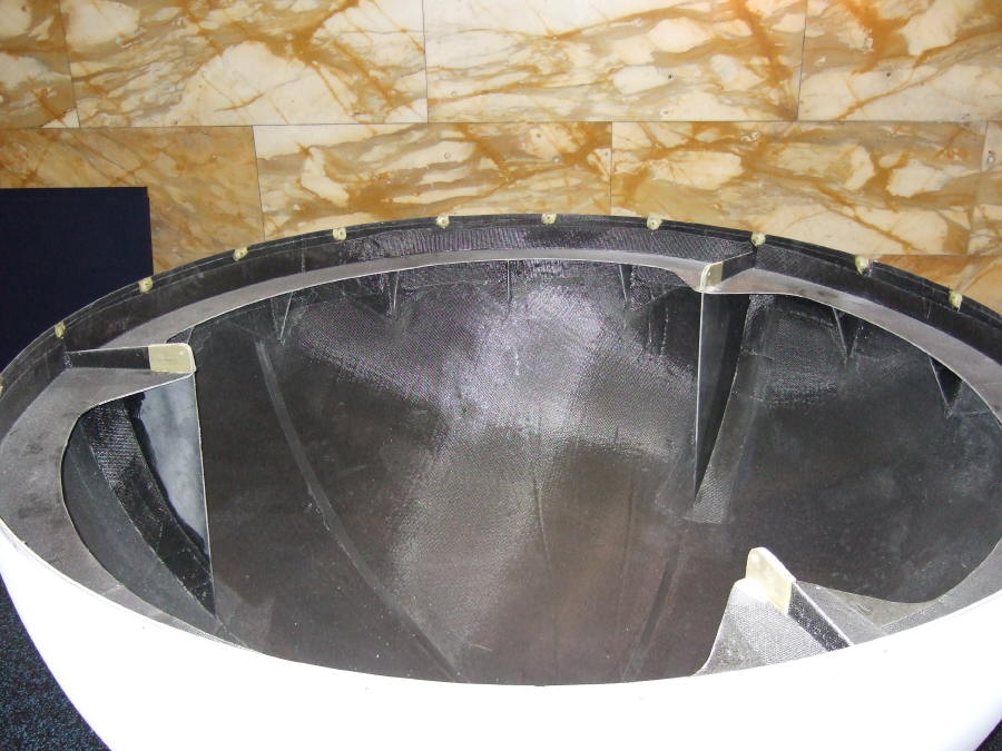 One half of a Science On a Sphere rests curved-side-down. The three structural supports that are part of the Sphere's interior are visible