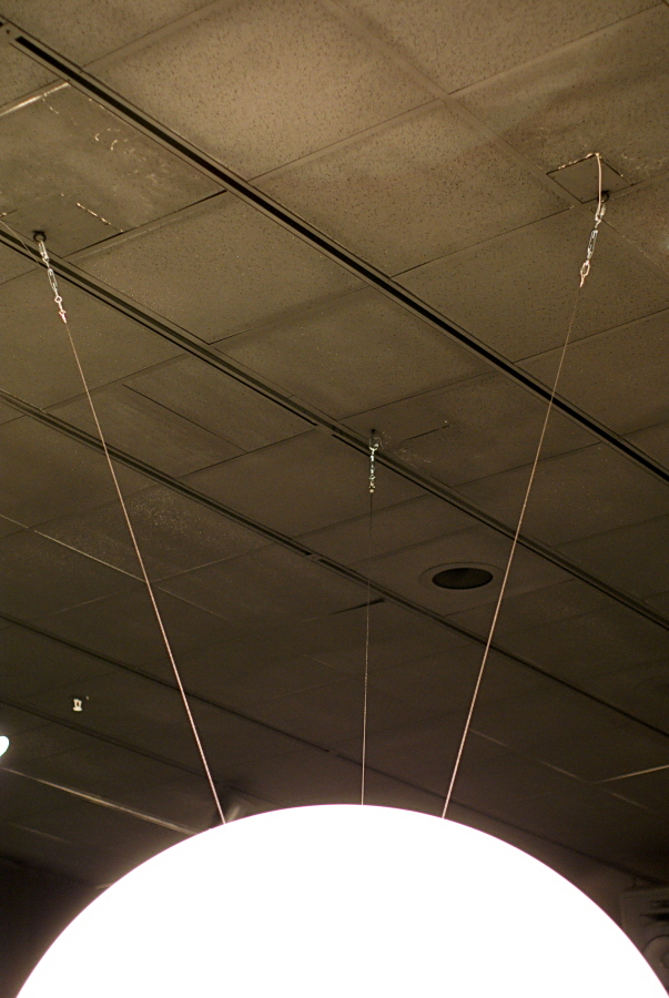 Science On a Sphere is hung from three eye bolts mounted directly into the ceiling. The eye bolts are positioned at the corners of an equilateral triangle
