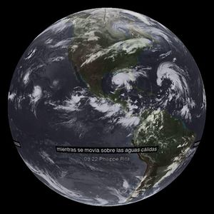 Hurricane Rita dataset with Spanish captions reading “mientras se movia sobre las aguas calidas”